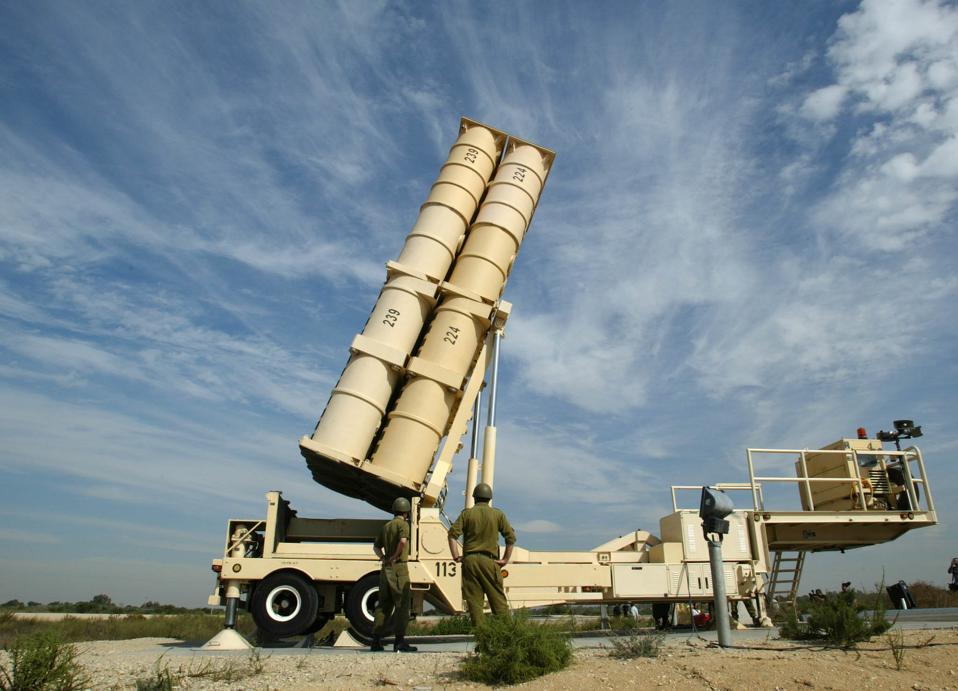 Israeli soldiers raise an Arrow missile launcher t