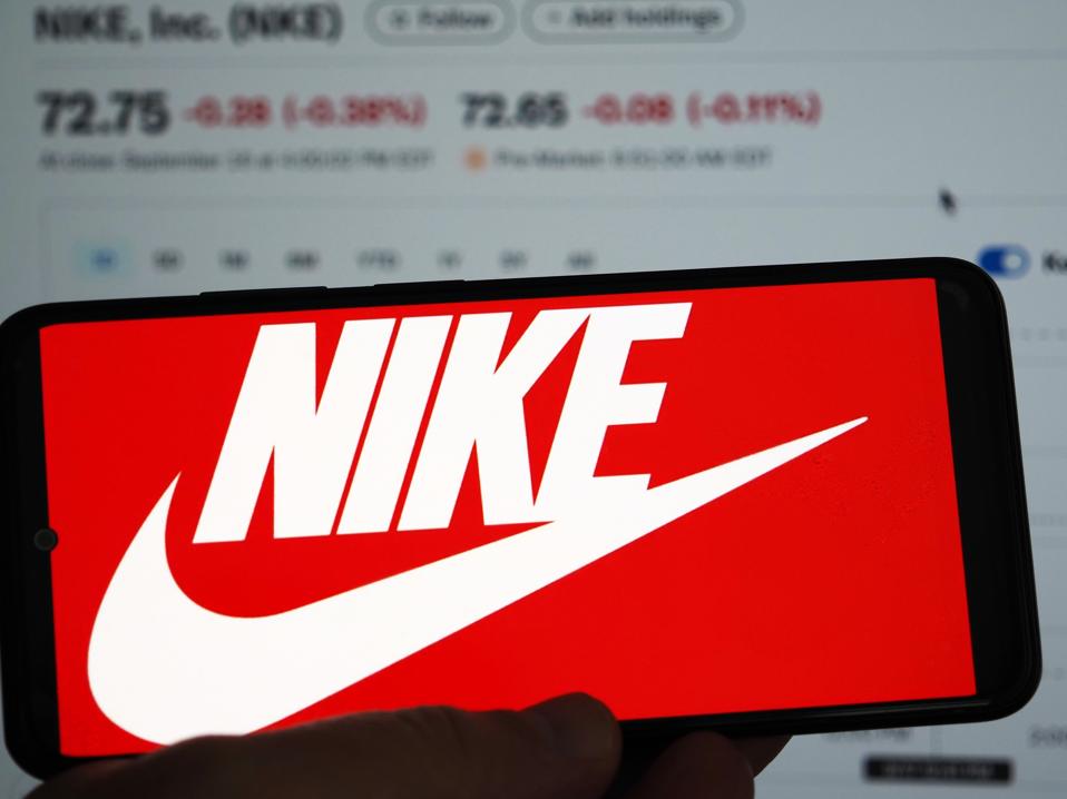 In this photo illustration, the Nike logo is displayed on a...