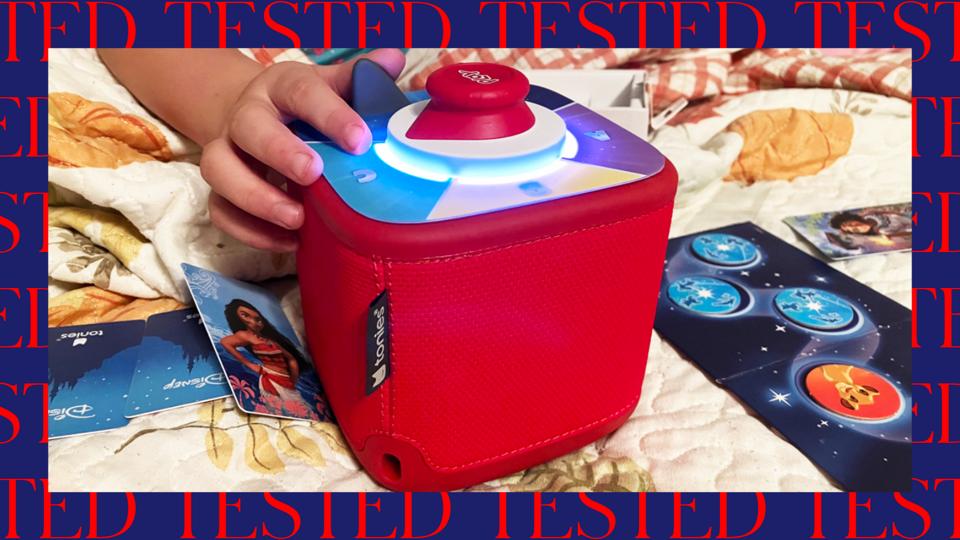 Child's hand playing with a red Toniebox 2 Tonieplay Game