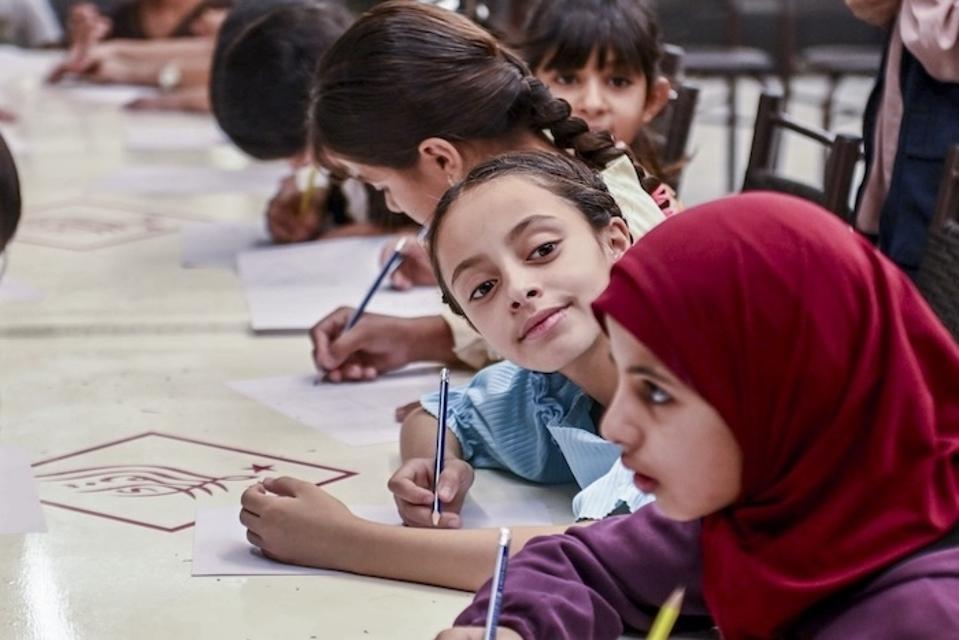 Children take part in a drawing activity at a UNICEF-supported shelter in Rural Damascus, Syria.