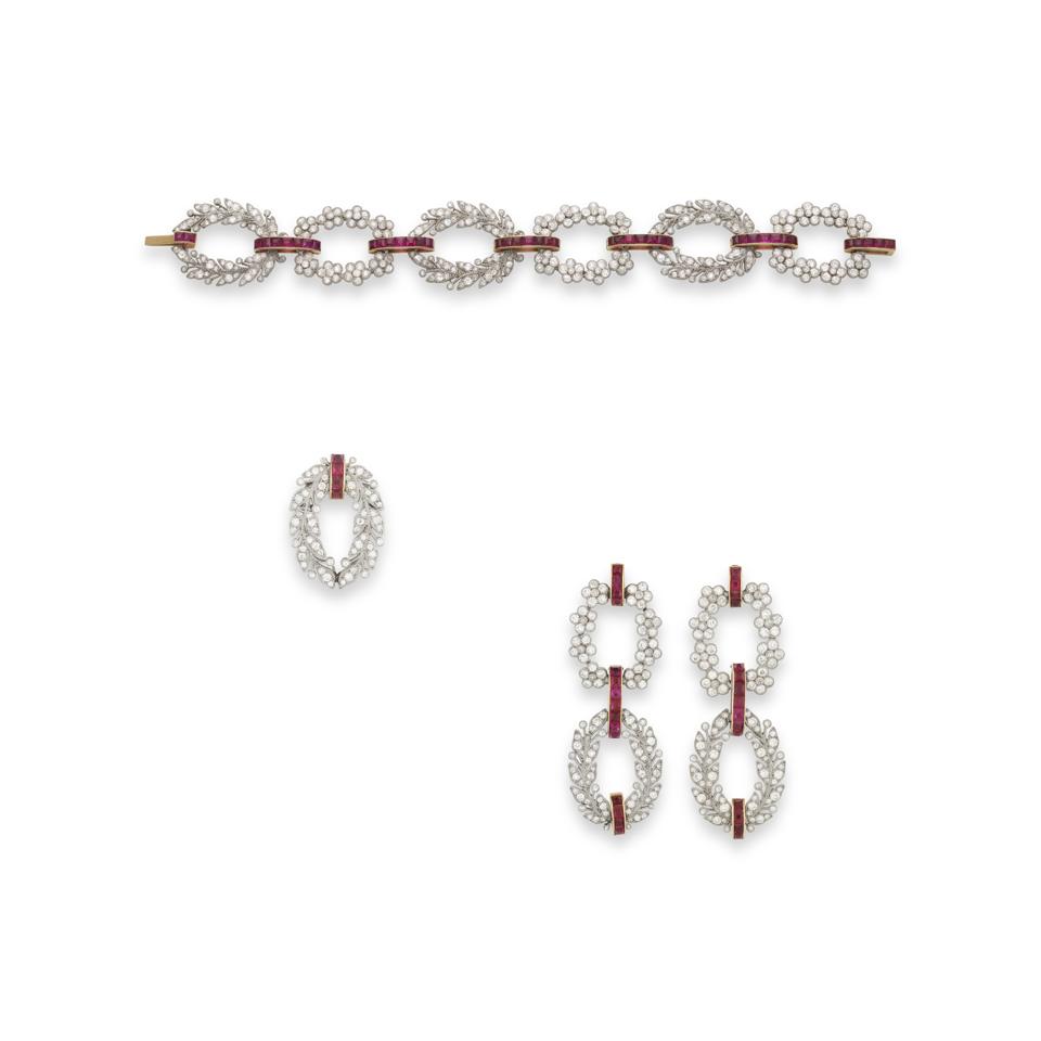 Cartier ruby and diamond bracelet, earrings, and brooch, 1904. Estimate:$45,000-$80,000 