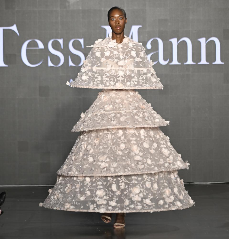 model in tiered dress