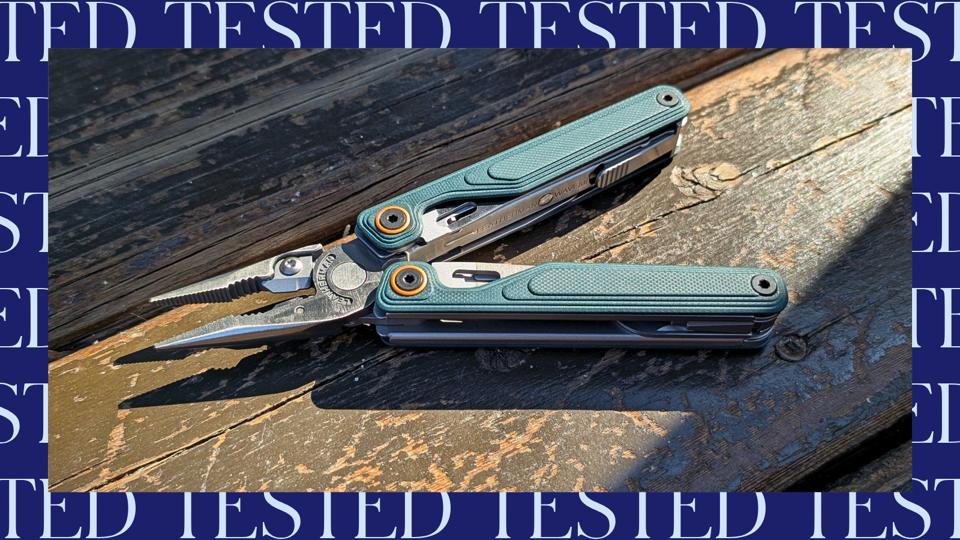 Leatherman Wave Alpha in green on a wooden porch, in the sun