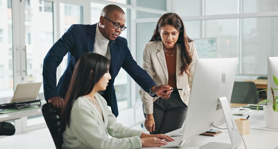 Colleagues Collaborating in a Modern Office Environment on a Computer Screen