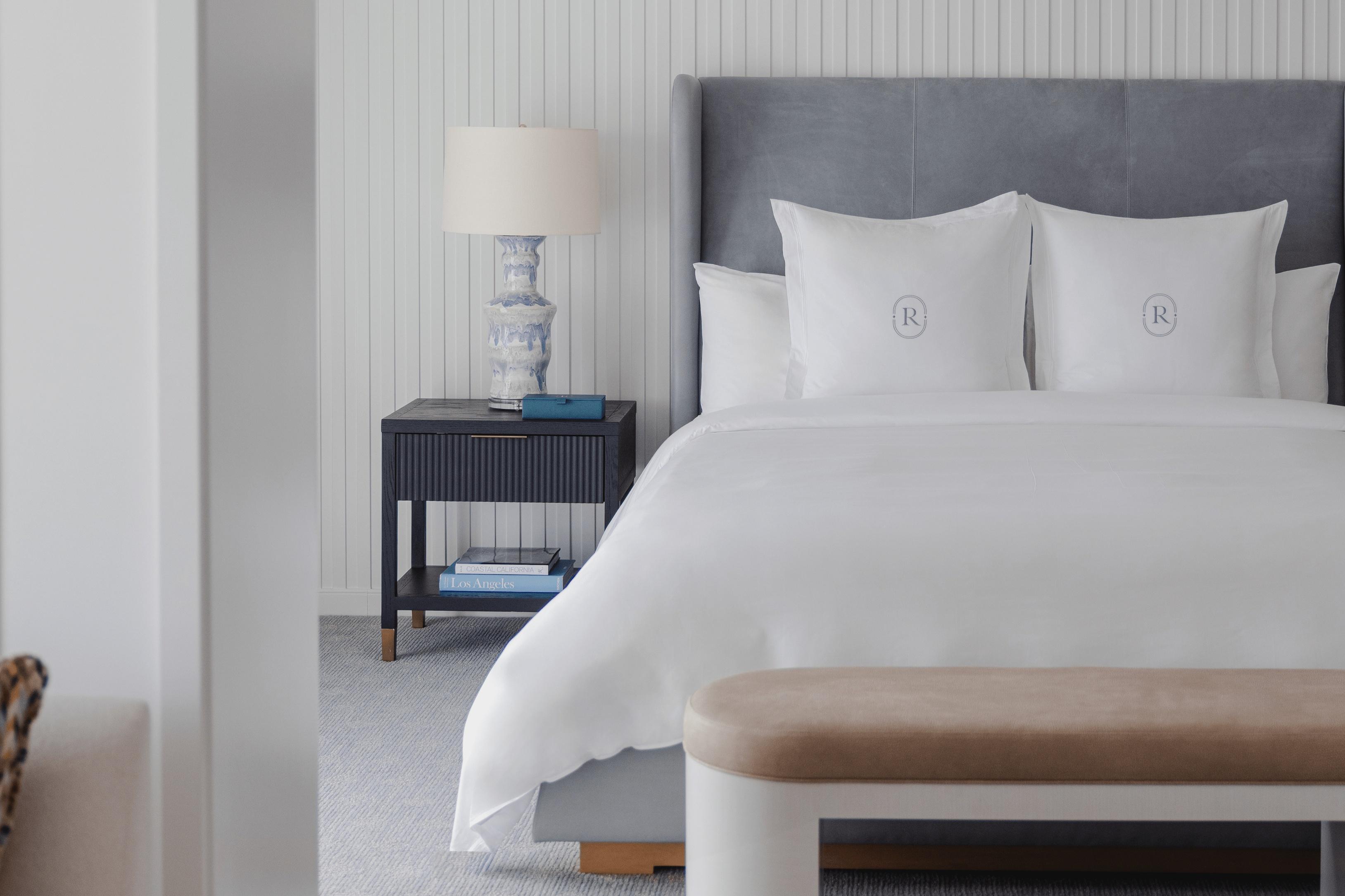 A guest room with crisp white bedding at the Regent Santa Monica Beach
