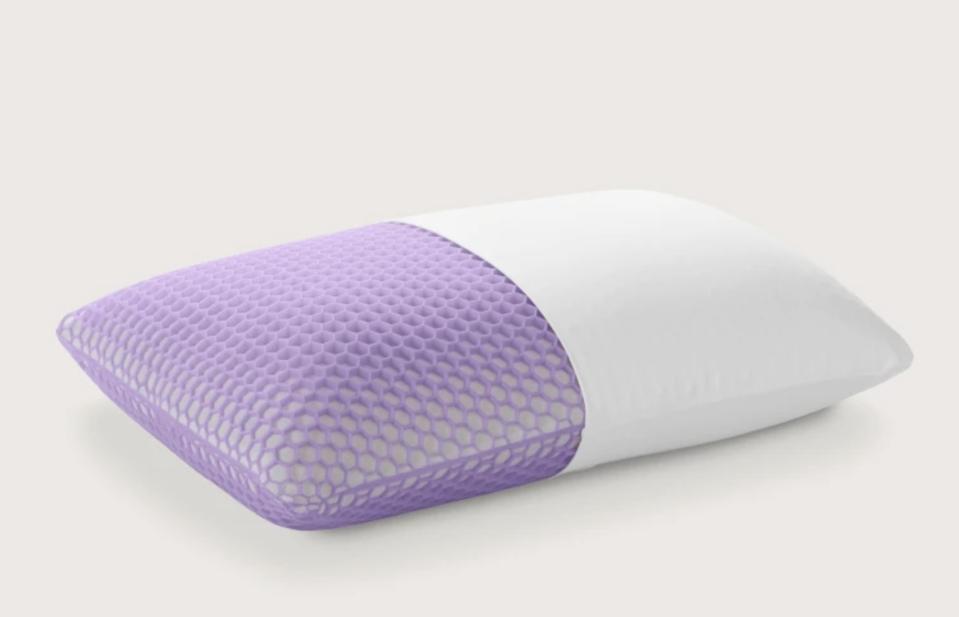 The Purple Harmony Pillow against a beige background. 