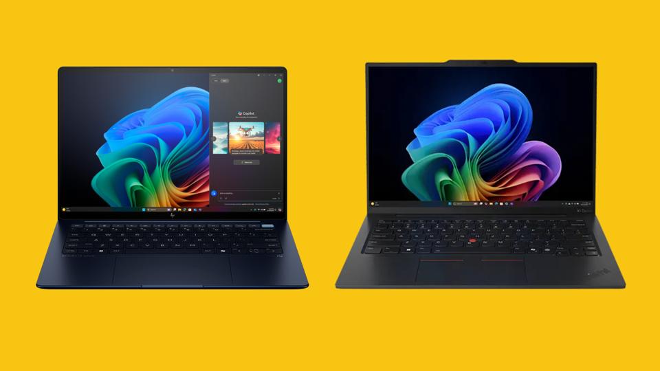 Two laptops against a bright yellow background.