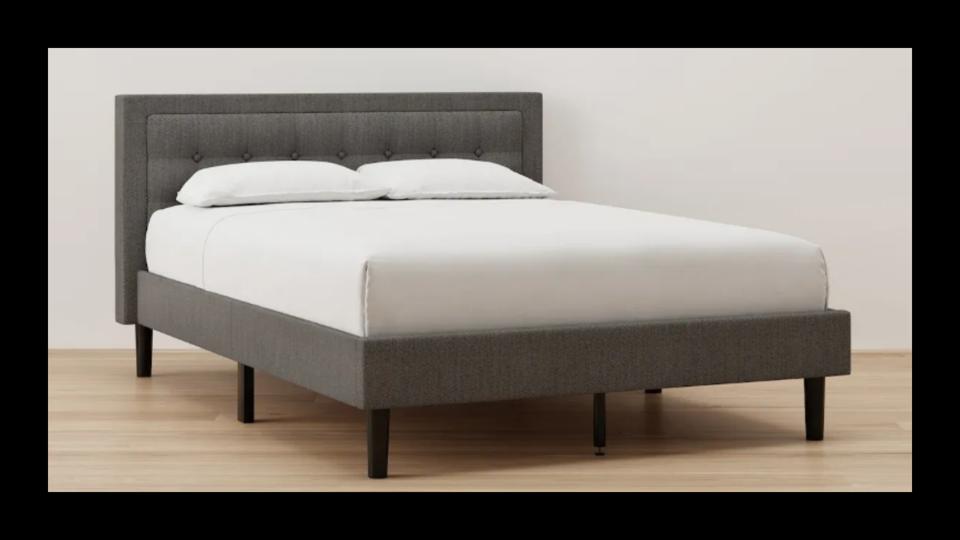 The Nectar Bed Frame with Headboard in a show room.