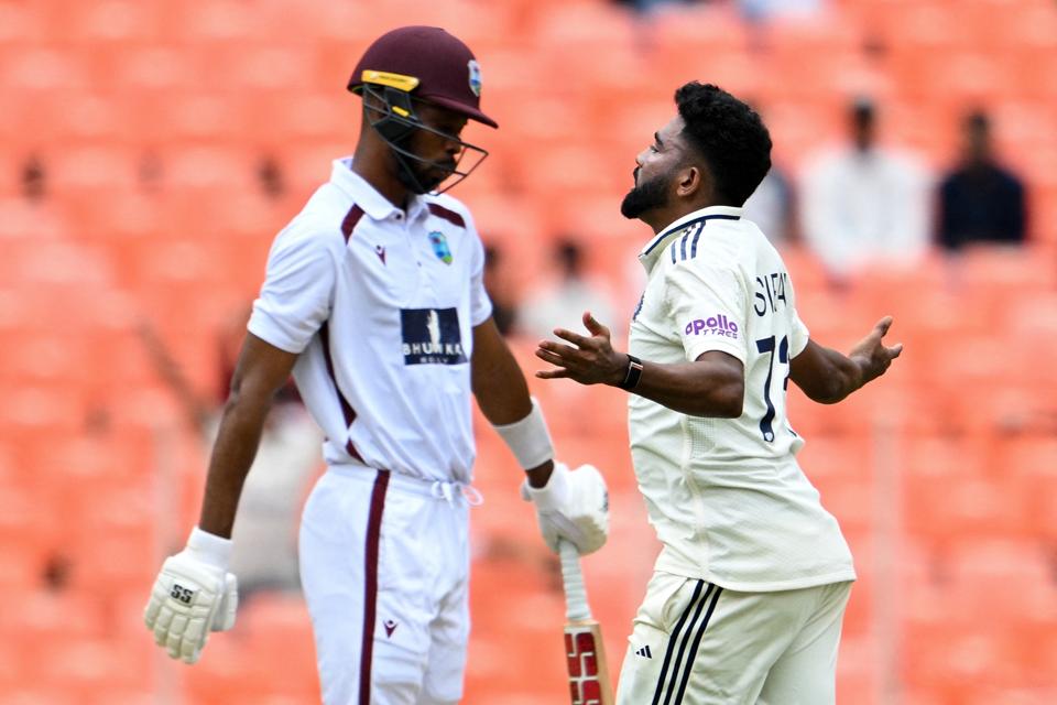 Roston Chase falls to Mohammed Siraj in the first Test between India and West Indies.