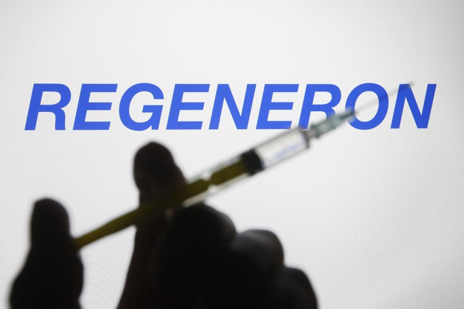 In this photo illustration a Regeneron Pharmaceuticals logo...