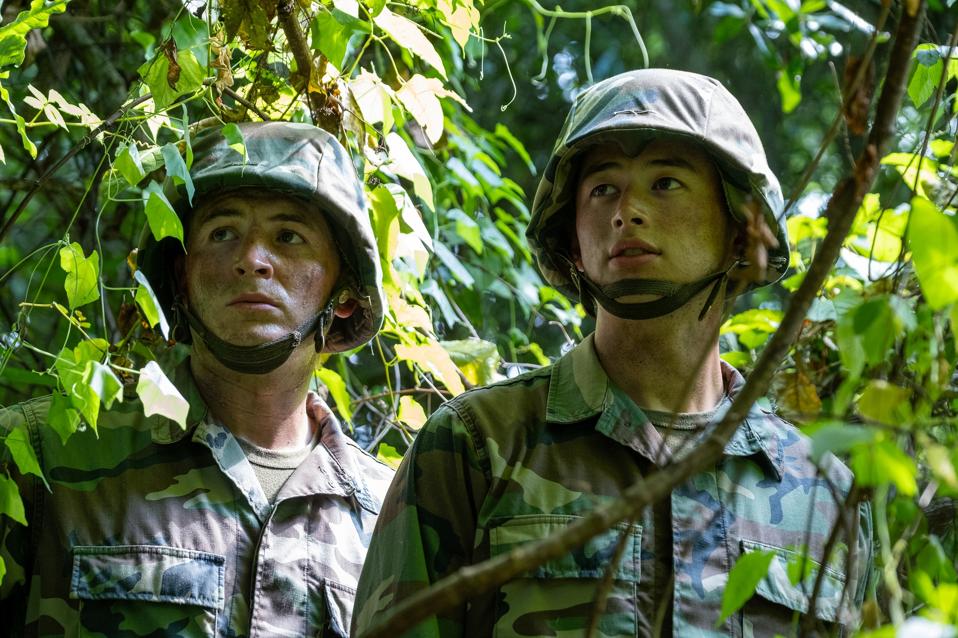 BOOTS. (L to R) Kieron Moore as Slovacek and Liam Oh as Ray McAffey