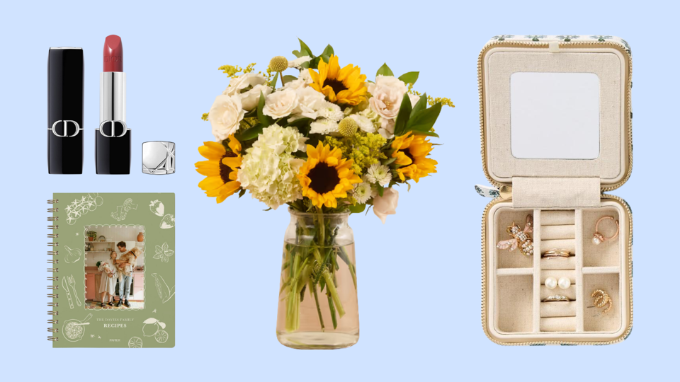 Dior lipstick, Papier journal, The Bouqs Co. flowers, jewelry box on a blue background.