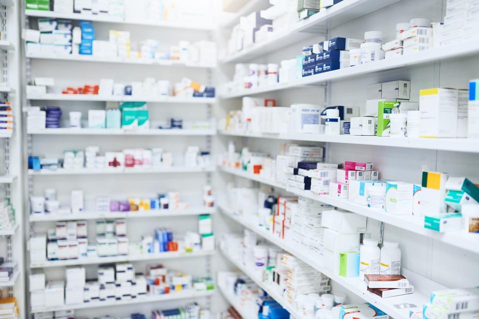 Photo of shelves stocked with various medicinal products in a pharmacy