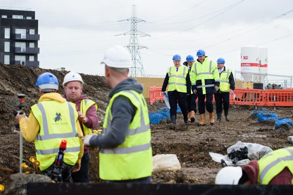 Zac Goldsmith And David Cameron Visit A Housing Construction Site