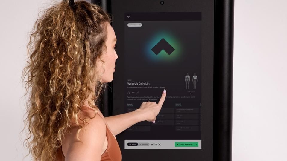 woman selecting Daily Lift routine on Tonal screen