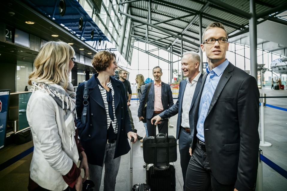 Business people waiting at the airport checkin