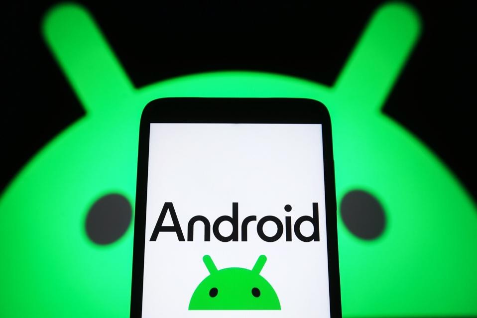 In this photo illustration, a new Android logo is seen on a...