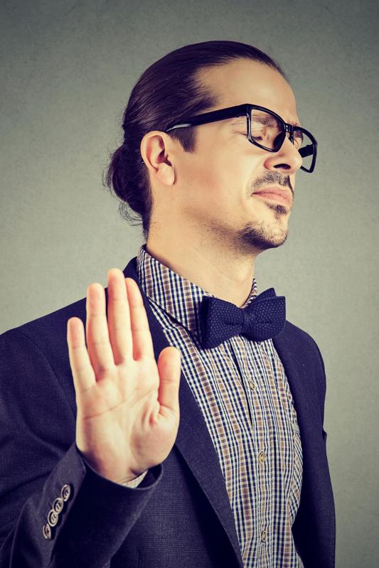 Offended man giving stopping gesture