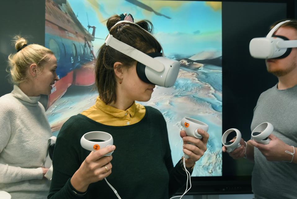 Students using laptops in a university classroom, learning AI and digital skills for future jobs