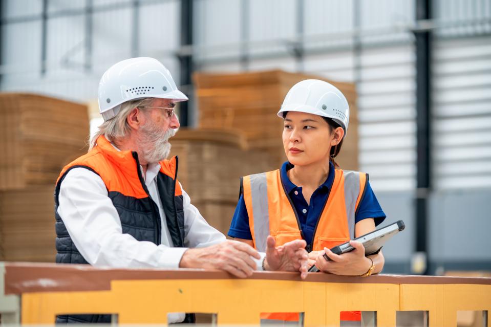 First impressions introduce is the way you have well known in organizing. Female southeast Asian Engineer reporting production results and performance to her senior management officer on a production line in the factory.