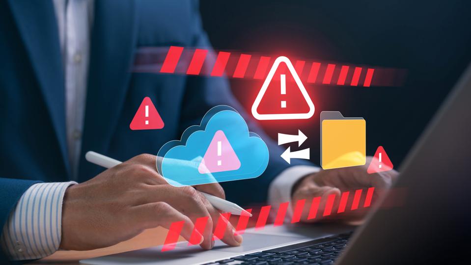 Leader experiencing AWS Cloud storage failure with cybersecurity, with red warning icons