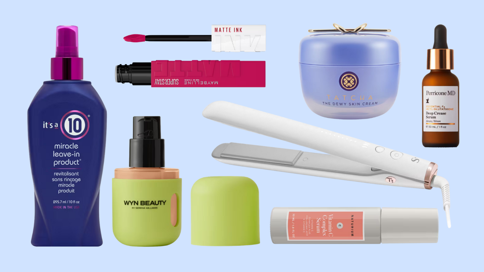 Various beauty products, including It's A 10 spray, T3 flat iron and Maybelline lipstick, on blue bg.