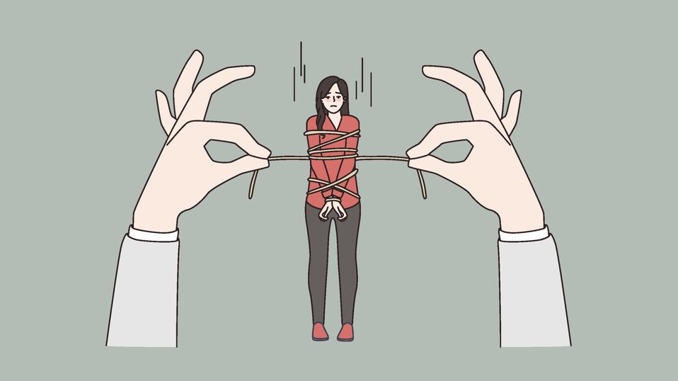 Stressed woman tied with rope by huge hands