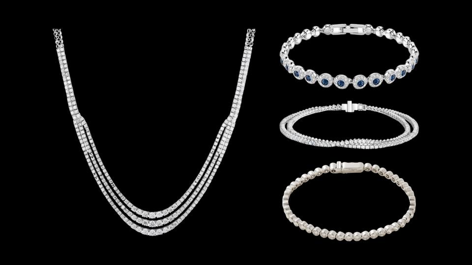 4 pieces of tennis jewelry on a black background