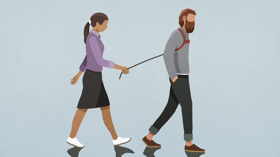 Woman walking man with harness