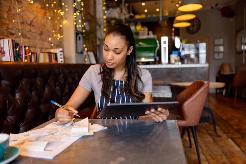 Small business owner assessing her business finances. 