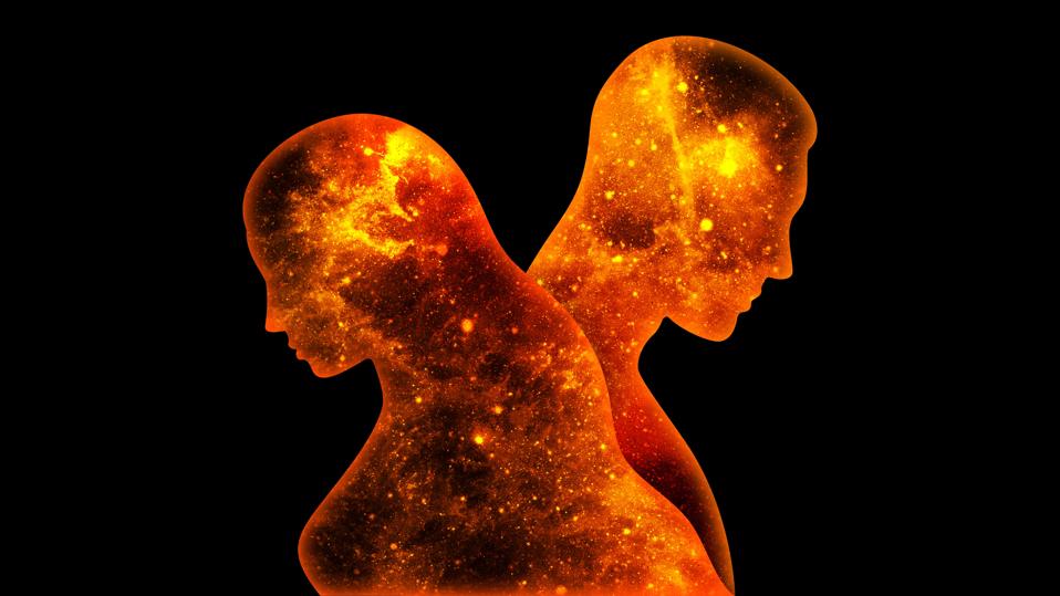 Orange space man and woman stand back to back on a black background