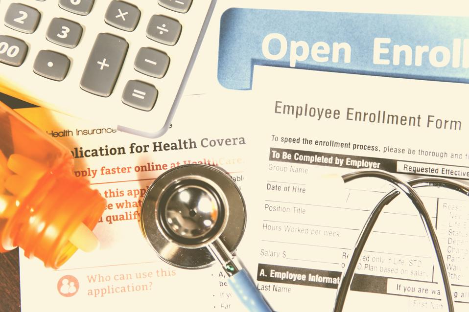 Open enrollment healthcare benefit forms.