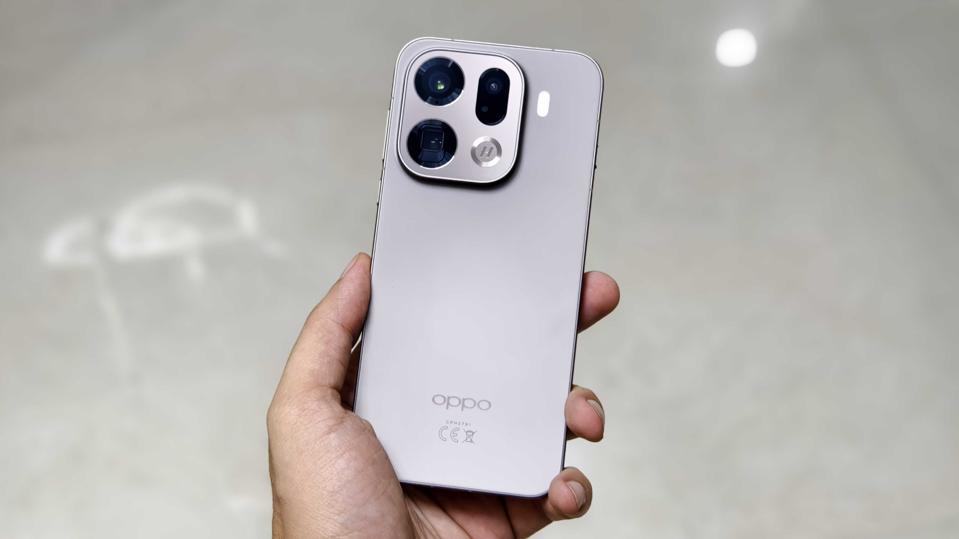 Prakhar Khanna holding the Oppo Find X9 Pro.