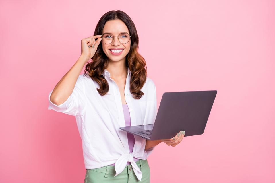Photo of young attractive businesswoman use laptop for making the most of meetings