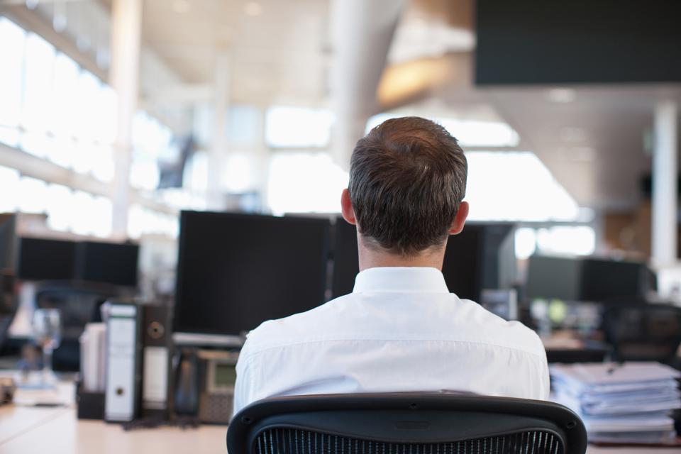 Businessman working at desk in office