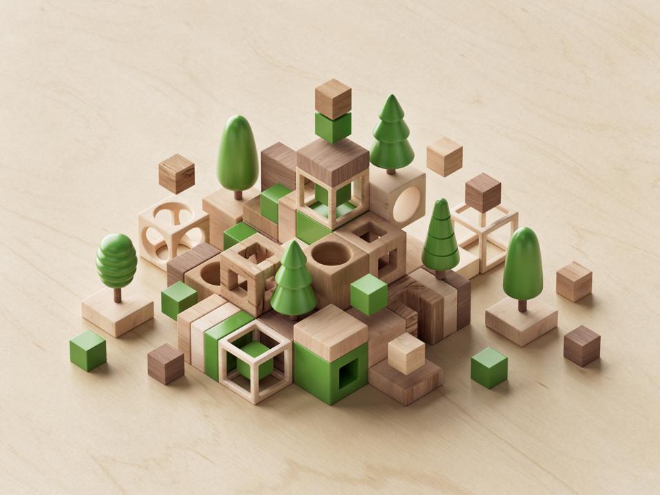 Digitally generated image of wooden abstract cubes and trees. The concept of ESG, sustainability and responsible business.