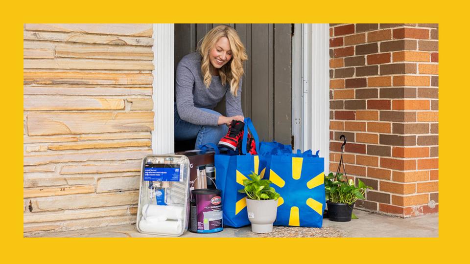 Photo of woman collecting her Walmart order.