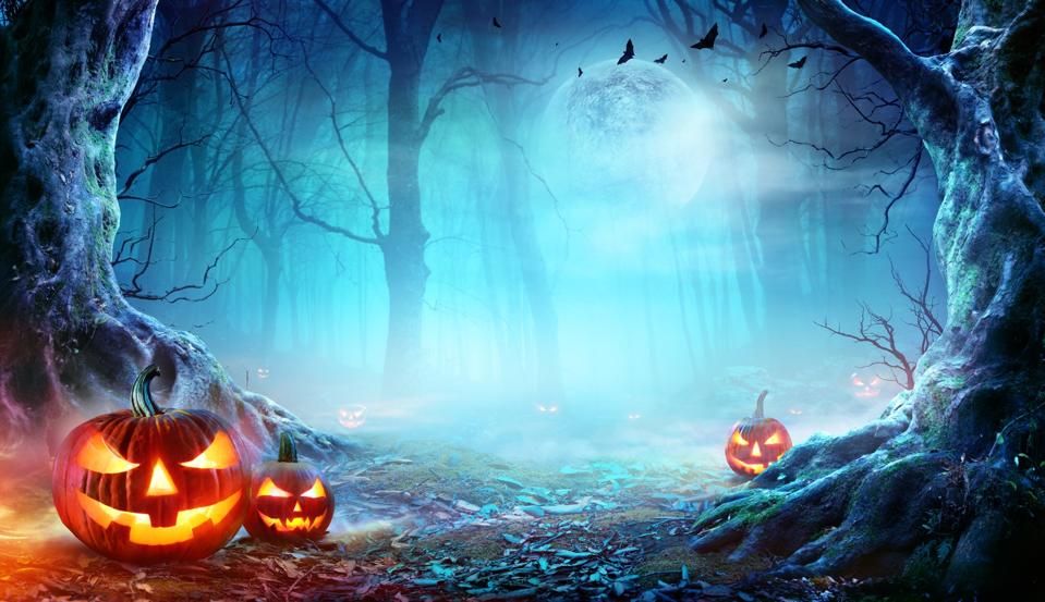 Halloween Pumpkins Smiling In Cloud of Mist and Forest At Moonlight