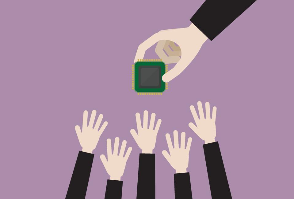Business people grab a computer chip