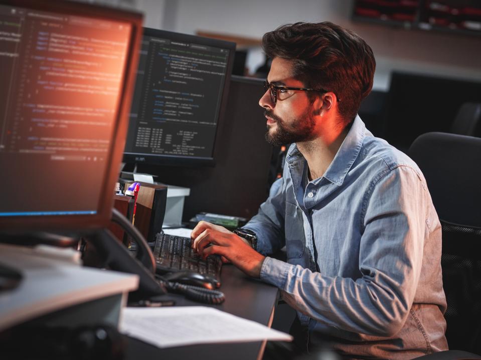 Male programmer working on new project.