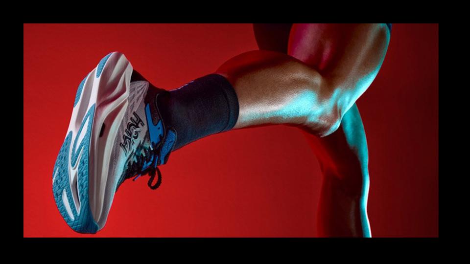Person running in Hoka sneakers.