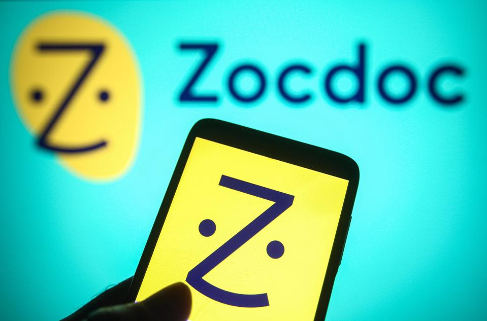 In this photo illustration a Zocdoc logo seen on a…