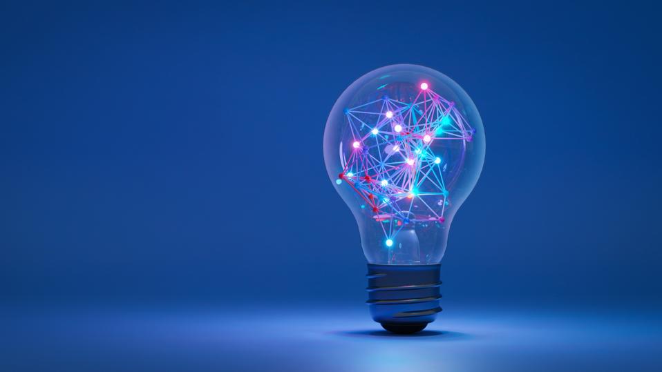Illustration of a lightbulb set in a spotlight against a dark blue background. The lightbulb contains multiple lighted nodes connected by brightly colored lights. Innovation in technology concept.