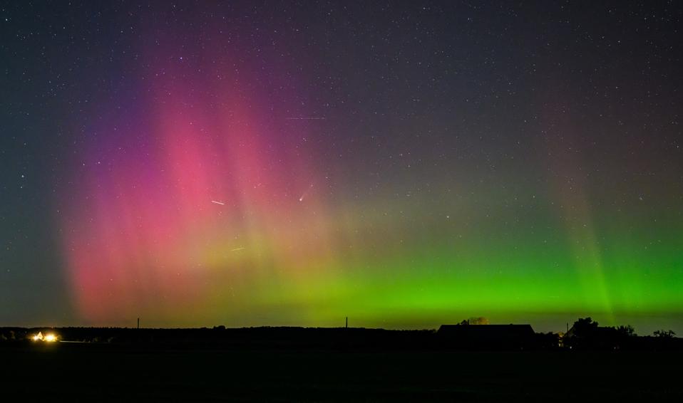 Aurora borealis and comet light up the night sky