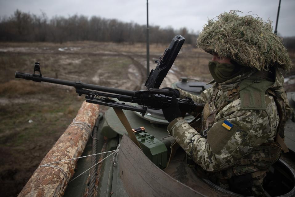 Ukrainian soldier with a machine gun In Donetsk Oblast