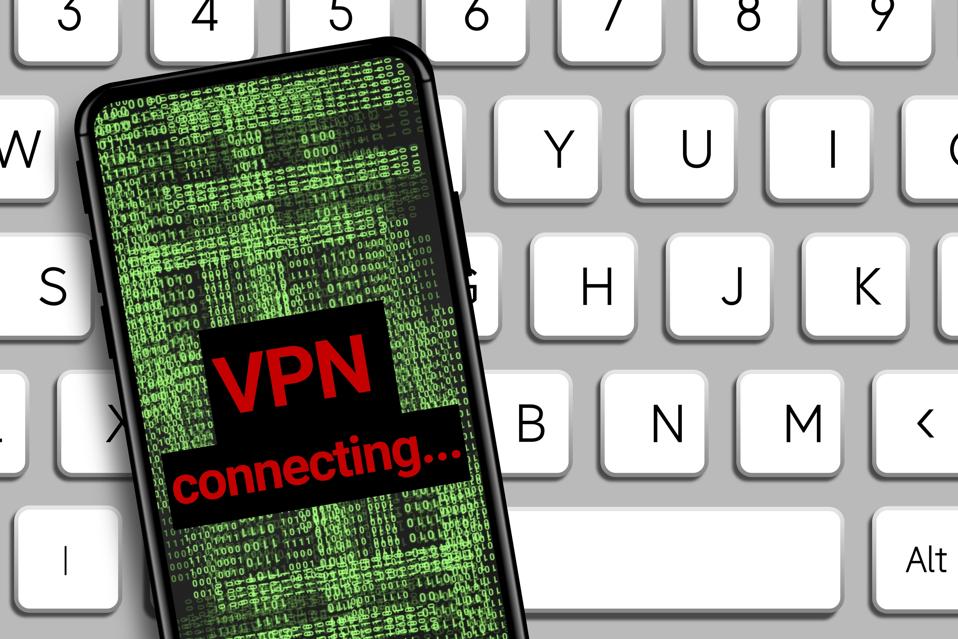vpn connecting word and Hacker icon in mobile phone with digital code numbers.