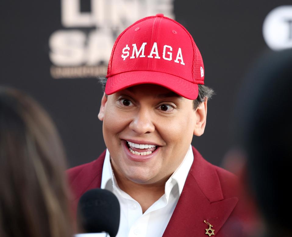 George Santos wearing "$MAGA" hat