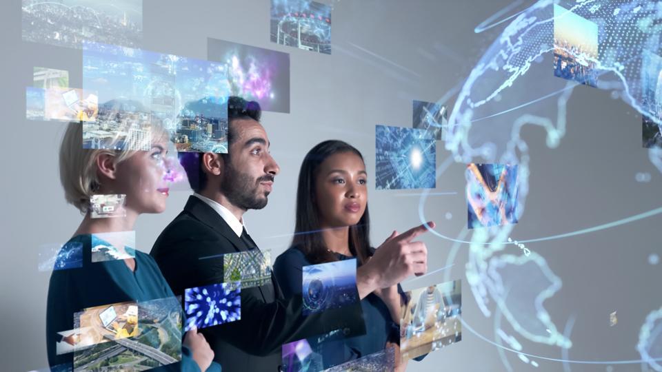 Young diverse team interacting with holographic data, combining AI skills and soft skills