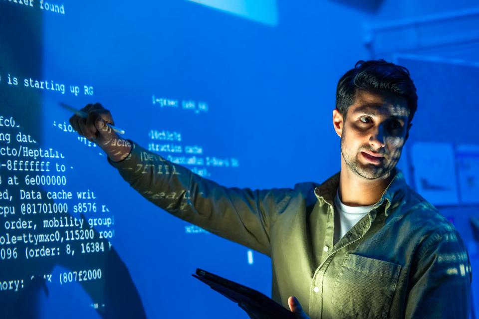 The discussions to create the best solutions for business management strategy. The business executive of coding solutions gave a presentation on gateway performance infographic data to make strategy planning at a meeting board in a tech business office.