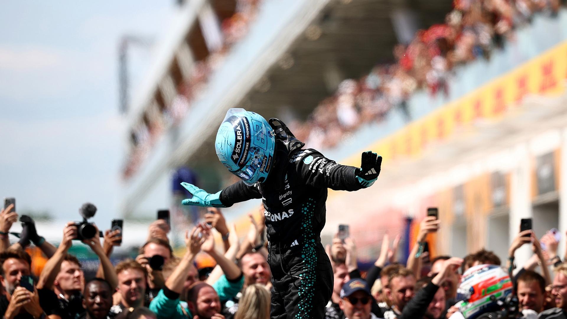 Mercedes Formula 1 driver George Russell celebrating after a race.
